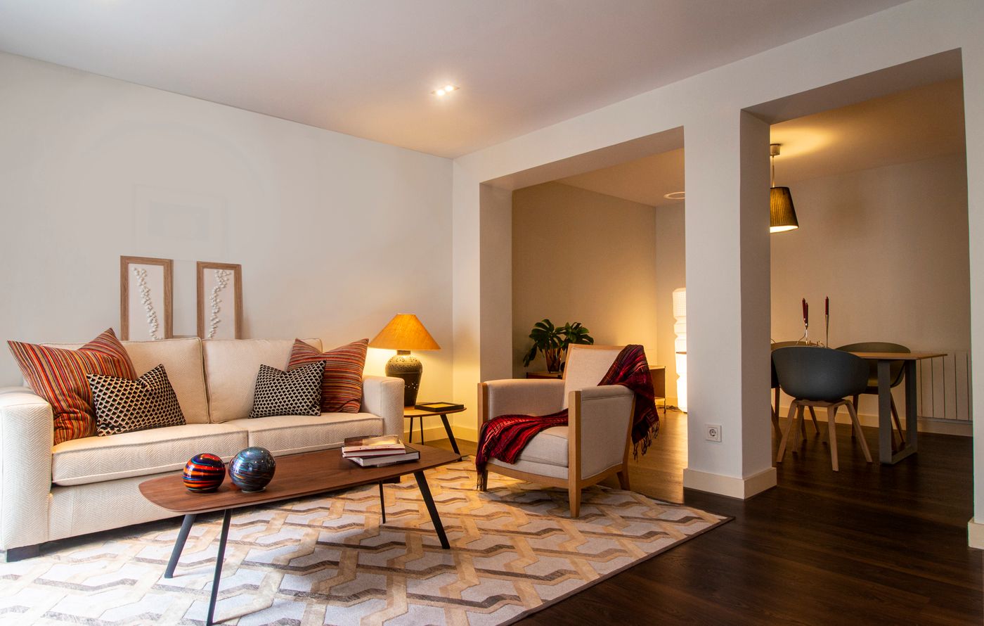 A warm, well-lit living room with comfortable seating